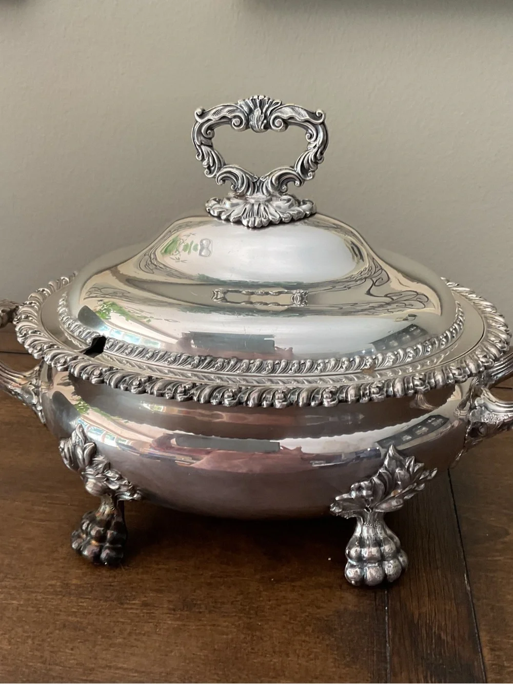 Ornate Silver-Plated Covered Soup Tureen with Decorative Handle.